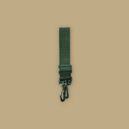 Green strap with a carabiner on a beige background Mandai Wildlife Reserve